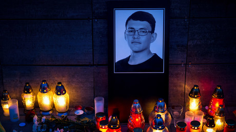 Candles and a portrait of Jan Kuciak are pictured in front of the Aktuality newsroom in Bratislava, February 26, 2018 / VLADIMIR SIMICEK 