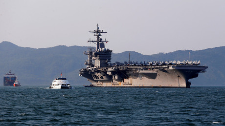 U.S. Navy aircraft carrier, USS Carl Vinson, docks at a port in Danang, Vietnam March 5, 2018. © Nguyen Huy Kham