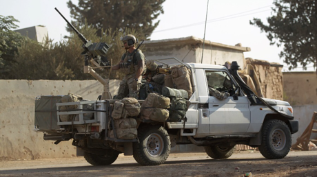 US soldiers ride a military vehicle in al-Kherbeh village, northern Aleppo province, Syria October 24, 2016 © Khalil Ashawi