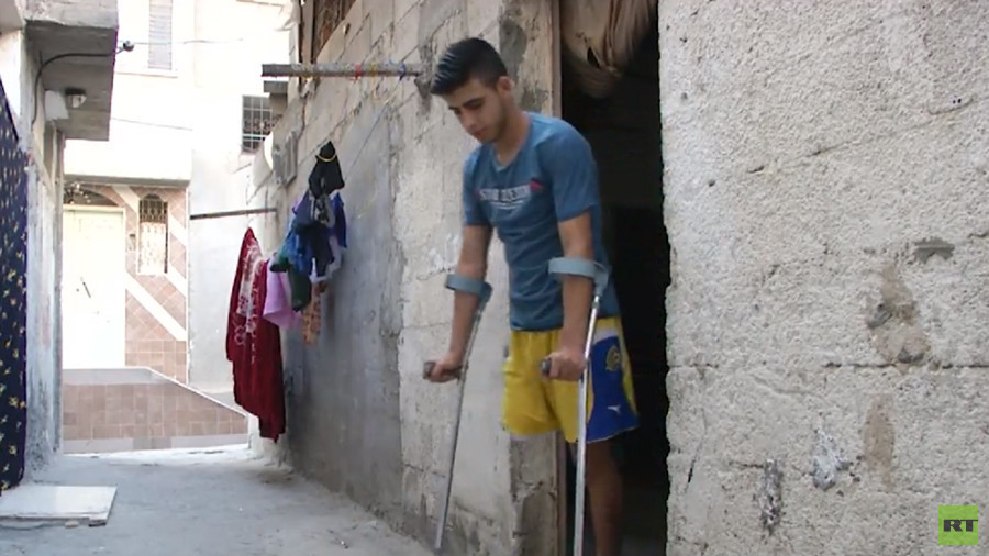 ‘I didn’t think my leg would be like this’: Gazan who lost limb in IDF sniper fire talks to RT