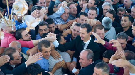 Syria's President Bashar al-Assad greets his supporters during Eid al-Adha prayers on September 1, 2017, Syria. © SANA