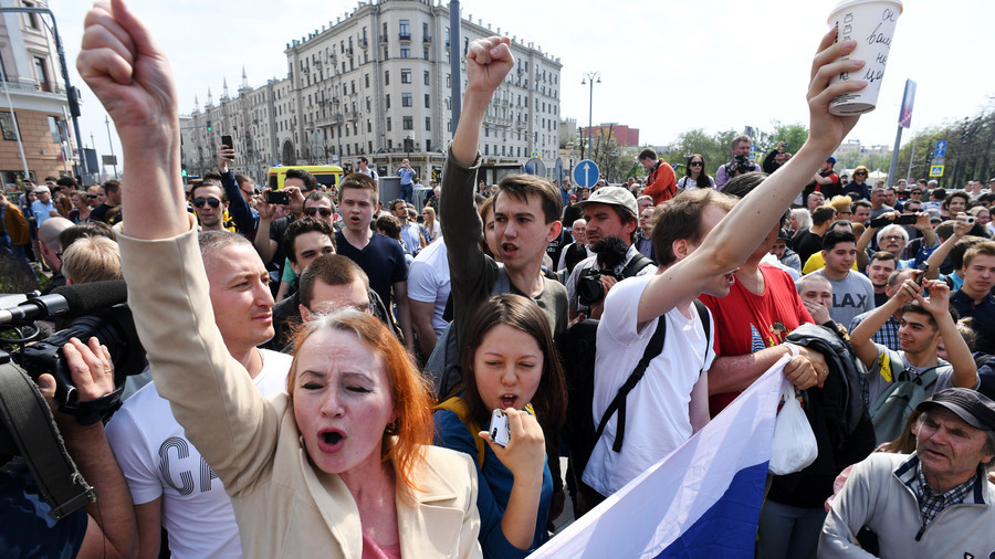 Opposition supporters rally across Russia, Navalny briefly detained at unsanctioned Moscow protest