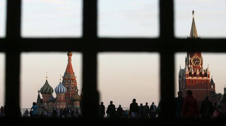 Red Square, St. Basil's Cathedral (L) and the Spasskaya Tower of the Kremlin are seen through a gate in central Moscow, September 18, 2014. © Maxim Zmeyev 