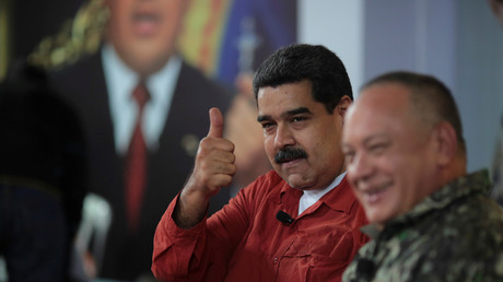 FILE PHOTO: Nicolas Maduro sitting together with Diosdado Cabello