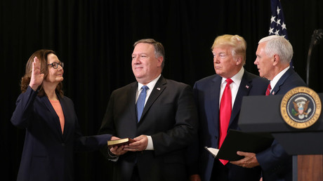 CIA Director Gina Haspel is sworn by U.S. Vice President Mike Pence as President Donald Trump looks on and Secretary of State Mike Pompeo holds the bible during ceremonies at the headquarters of the Central Intelligence Agency in Langley, Virginia, U.S. May 21, 2018. REUTERS/Kevin Lamarque