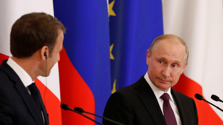 Russian President Vladimir Putin (R) and his French counterpart Emmanuel Macron attend a news conference after the talks in St. Petersburg, Russia May 24, 2018. Grigory Dukor