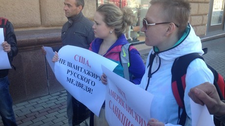 Protesters near US embassy in Moscow with slogans  reading 
