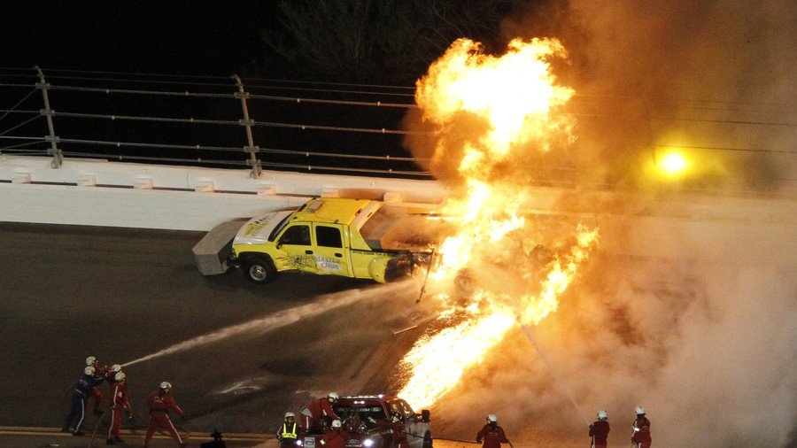 Father rescues son from race auto after fiery crash
