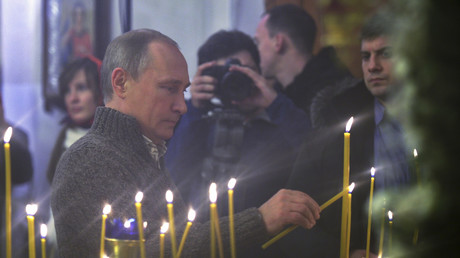 Vladimir Putin attends an Orthodox Christmas service