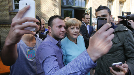 FILE PHOTO Migrants from Syria and Iraq take selfies with Angela Merkel, Berlin, Germany ©Fabrizio Bensch