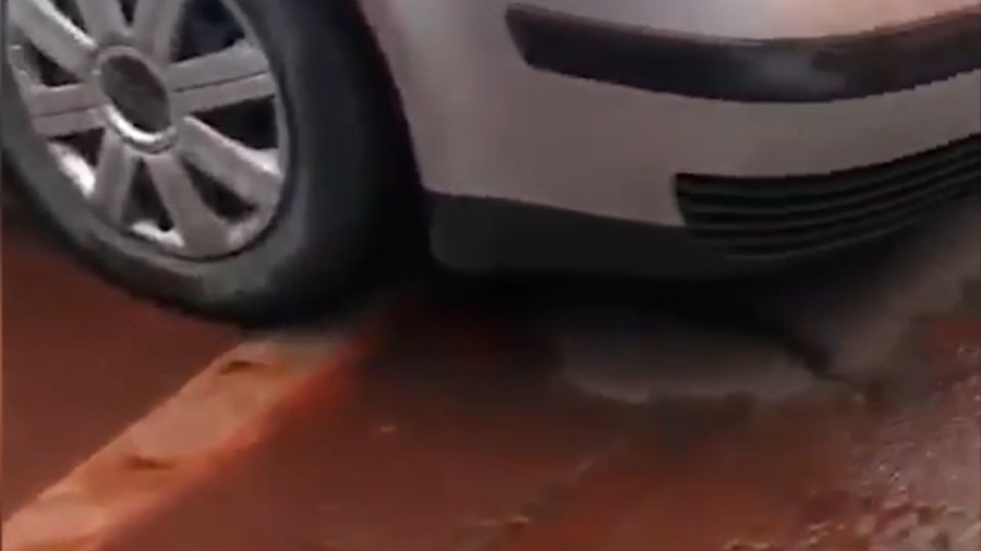 Siberia going biblical? ‘Blood rain’ pours down on Russian parking lot (PHOTOS)