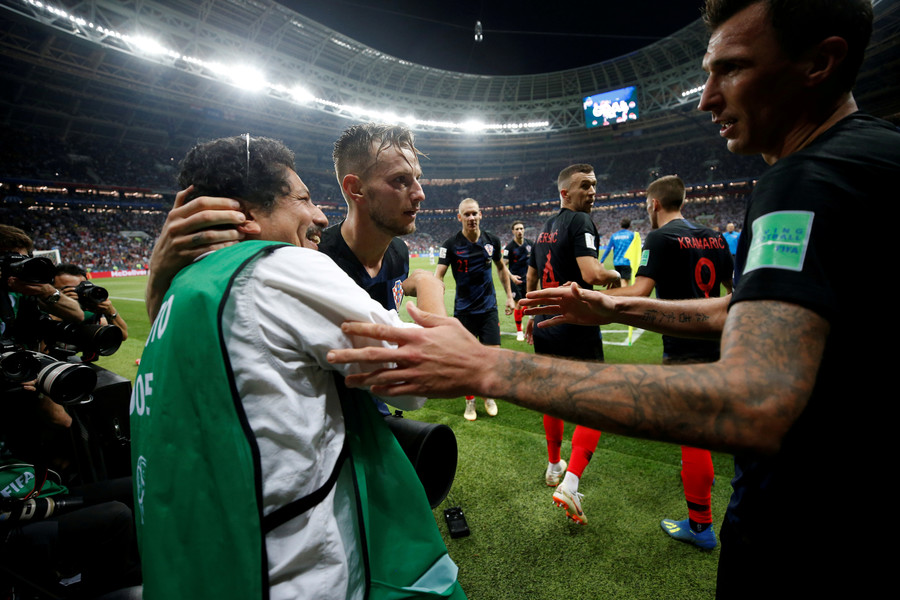 Croatian players send photographer sprawling amid wild World Cup