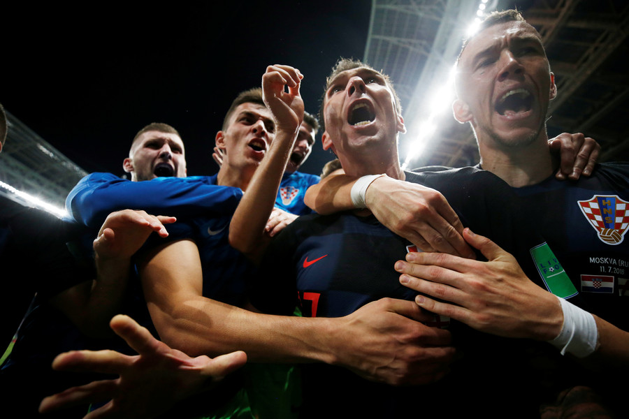 Croatian players send photographer sprawling amid wild World Cup