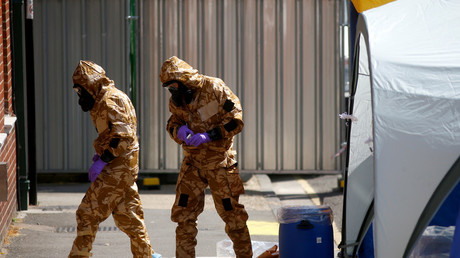  Forensic investigators wearing protective suits in Amesbury, Britain, July 6, 2018. © Henry Nicholls