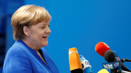 © German Chancellor Angela Merkel speaks with the media as he arrives at the Alliance's headquarters ahead of the NATO summit in Brussels, Belgium July 11, 2018. Darrin Zammit Lupi