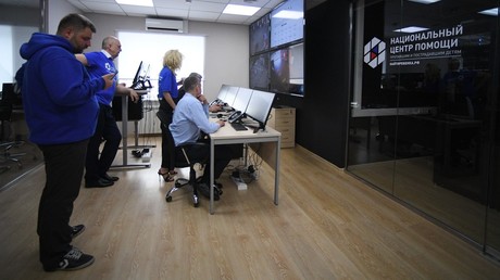 Staff members at the Situation Center for search of missing children, in Moscow © Eugene Odinokov 