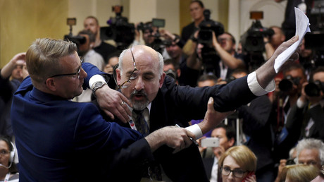 Security removes Sam Husseini before the Putin-Trump press conference in Helsinki. © Lehtikuva/Antti Aimo-Koivisto