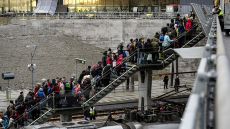 FILE PHOTO Refugees on a stairway leading up to trains at the Hyllie train station outside Malmo, Sweden