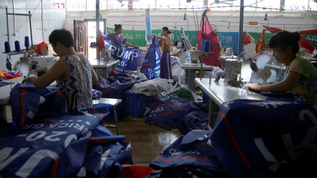 Chinese workers make flags for Donald Trump’s 2020 re-election campaign © Aly Song 