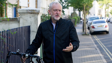 Jeremy Corbyn MP and Leader of the Labour Party leaving his home with his bicycle. © Pete Maclaine