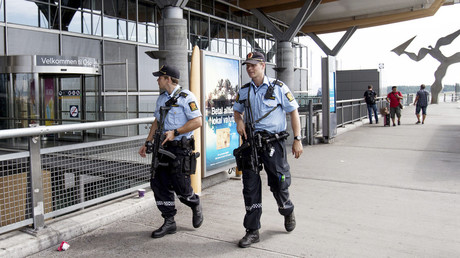 FILE PHOTO: Armed police officers patrol outside a terminal building at Oslo Airport, on July 24, 2014. © Audun Braastad 