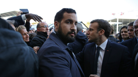 FILE PHOTO Emmanuel Macron  shakes hands as  Alexandre Benalla looks on during a visit to the 55th International Agriculture Fair in Paris