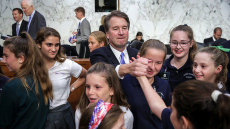 Kavanaugh with former players of the youth basketball team he coached, September 6, 2018 in Washington, DC. © Drew Angerer/Getty Images 