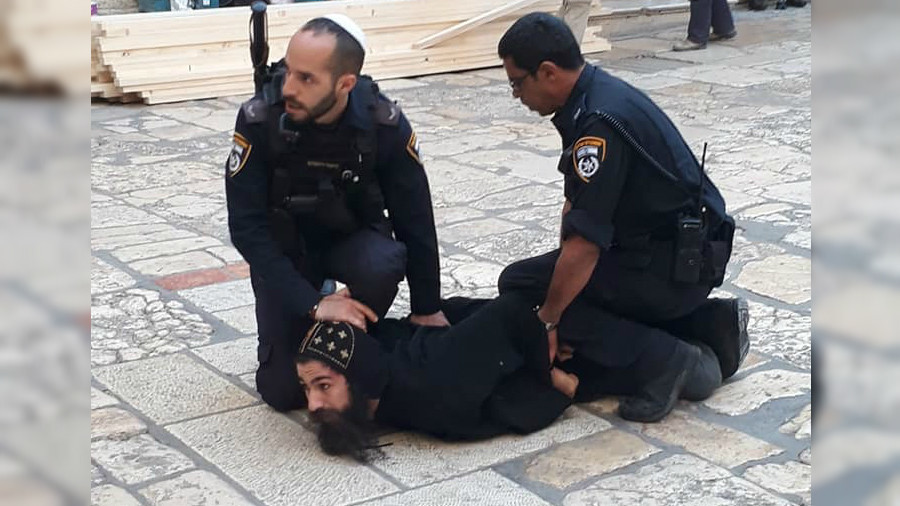 israeli forces arrest monk & forcibly remove others protesting