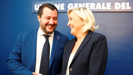 French National Rally leader, Marine Le Pen, and Italy's Lega leader and Interior Minister Matteo Salvini shake hands before holding a news conference in Rome, Italy, on October 8, 2018. © REUTERS/Max Rossi