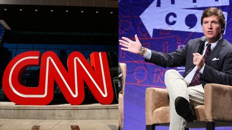 CNN logo and Tucker Carlson © (L) Reuters / Chris Aluka Berry; (R) AFP/ Phillip Faraone / Getty Images North America