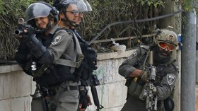 Israeli troops raid Palestinian news agency looking for footage, fire tear gas