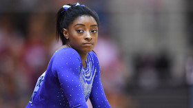 'Couldn't they have hired a black photographer?' Social justice warriors pick holes in Simone Biles' Vogue cover shoot