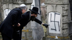 Strasbourg's Grand Rabbi inspects graves desecrated with anti-Semitic graffiti in 2018 © Reuters / Vincent Kessler