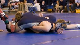 WATCH: Teen smashes right through gym ceiling during wrestling match
