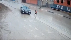 Child saved from certain death as driver makes last-second swerve (VIDEO)