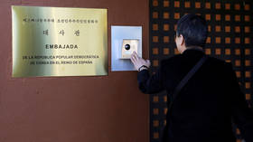 A journalist from South Korea rings an intercom of North Korea's embassy in Madrid, Spain on February 28, 2019.