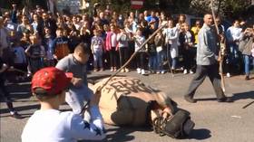 Poles BEATING & BURNING long-nosed effigy of Judas sparks fury of Jewish group (VIDEO)