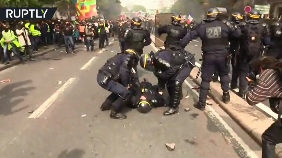 Injured cop collapses during May Day protests in Paris Injured cop collapses during May Day protests in Paris