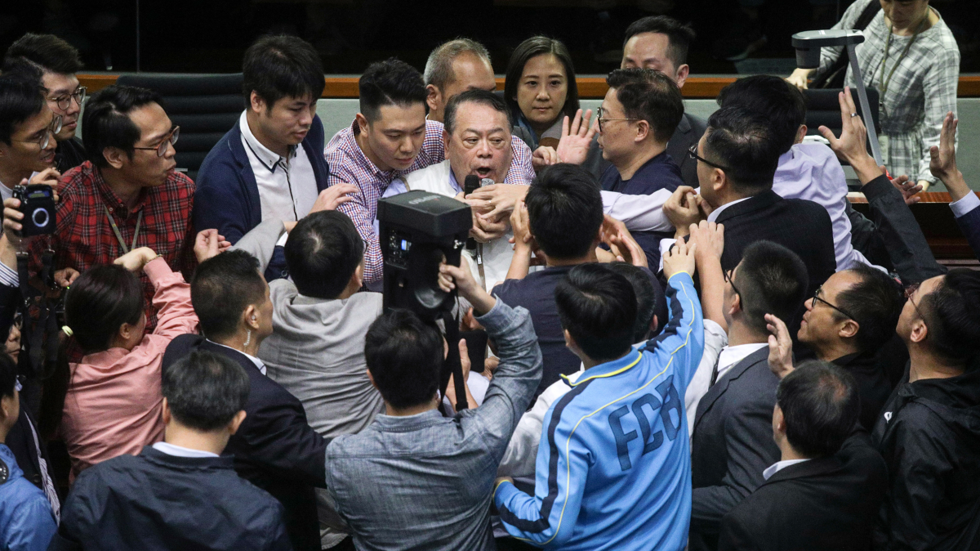 Fists fly in Hong Kong parliament as debate over extradition law boils over Fists fly in Hong Kong parliament as debate over extradition law boils over