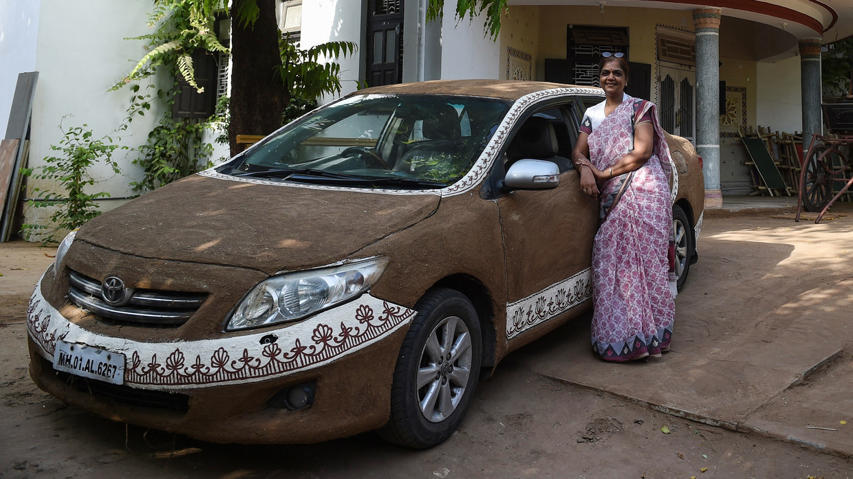 Toyota Cow Rolla Indian Woman Plasters Her Car With Bovine Dung