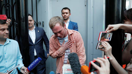 Russian journalist Golunov walks out of the city office of criminal investigations in Moscow on June 11, 2019.