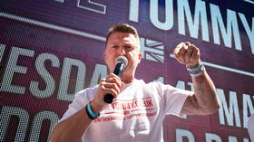 Tommy Robinson filmed punching England fan to the ground (VIDEO)
