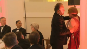 Tory MP Mark Field grabs climate change protester by the neck at Mansion House, London © ITV