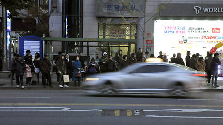 FILE PHOTO. A taxi cab drives at full speed through Seoul © Global Look Press / Thomas Michael Corcoran / ZUMAPRESS.com