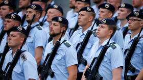 McAfee claims CIA tried to ‘collect’ him, poses armed in boat with his wife (PHOTO)