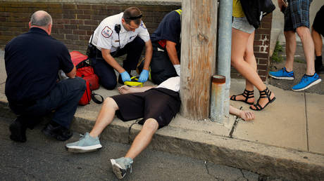 FILE PHOTO: Cataldo Ambulance medics and other first responders revive a 32-year-old man who was found unresponsive after an opioid overdose in the Boston suburb of Everett, Massachusetts, US, on August 23, 2017.