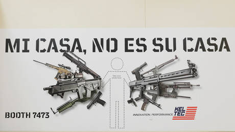 FILE PHOTO: An ad for an arms manufacturer at the NRA annual convention.
