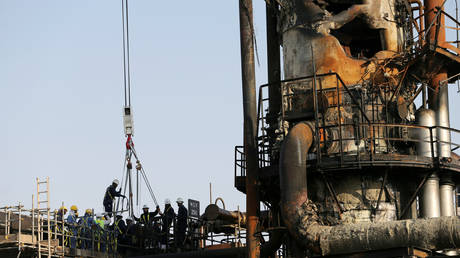 Workmen repairing the Saudi Aramco oil facility in Abqaiq, Saudi Arabia, September 20, 2019.