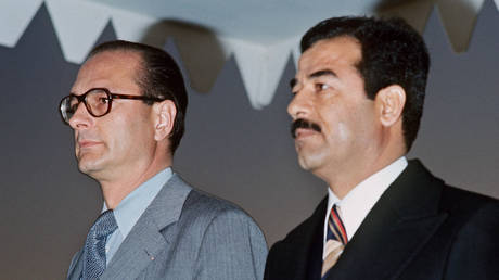 FILE PHOTO. French Prime Minister Jacques Chirac (L) and Iraqi President Saddam Hussein in Bagdad on January 25, 1976. ©AFP