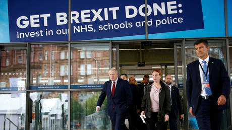 Britain's PM Boris Johnson is seen outside the venue for the Tory Party conference in Manchester © Reuters / Henry Nicholls